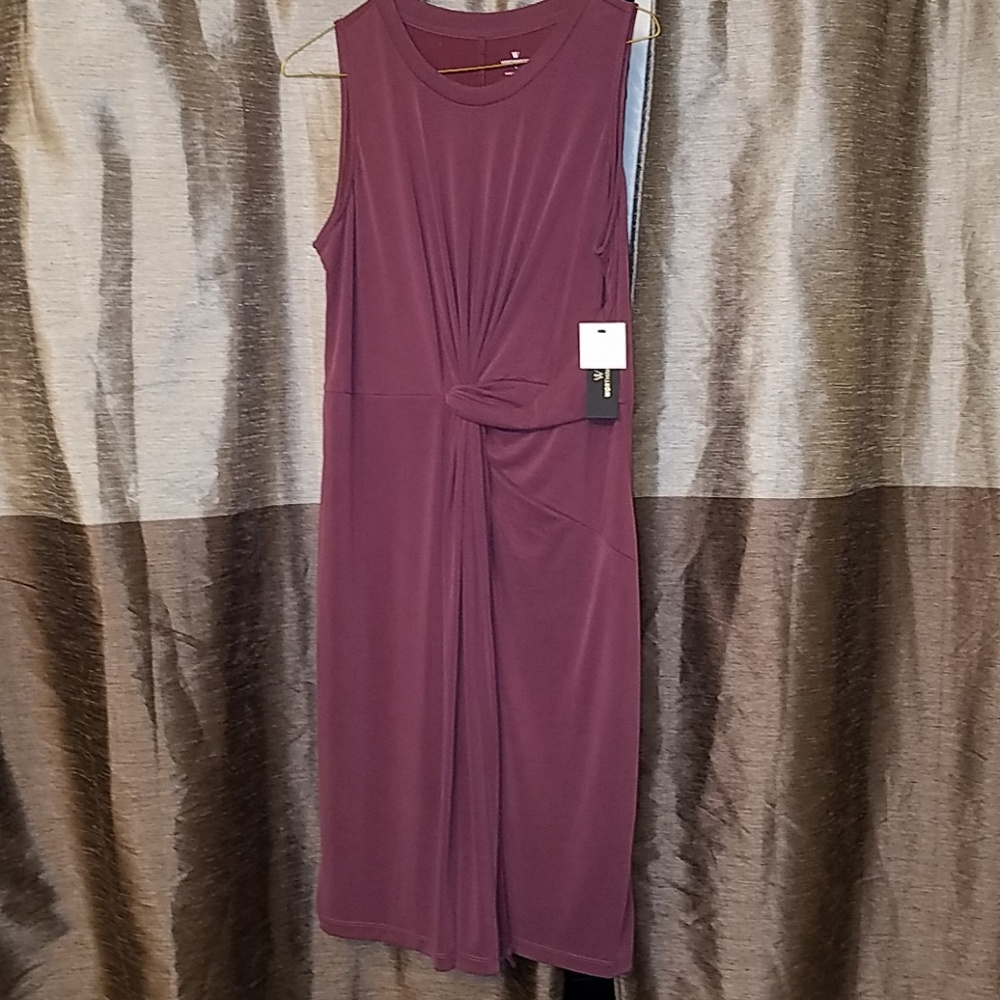 Sleeveless purple dress.